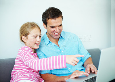 Buy stock photo Father, child and play game with laptop, entertainment and bonding together for weekend in house. Happy, man and daughter point in living room with computer, online gaming and family connection.