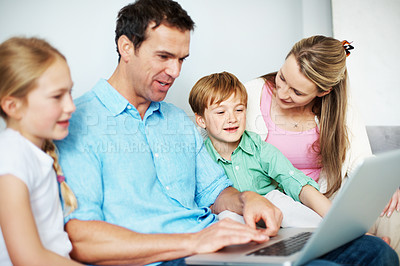 Buy stock photo Family, streaming and children with laptop in lounge, happy people or watch movie on website in home. Online, film and parents with kids in living room, man and woman with tech for entertainment