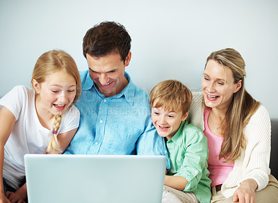 Buy stock photo Parents, children and laugh with laptop in home for comedy movie, weekend entertainment or bonding. Relax, happy family and kids with tech on sofa for funny online series, streaming film and support