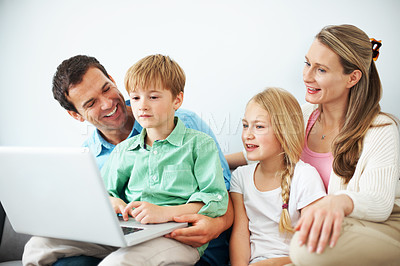 Buy stock photo Parents, children and video game in house with laptop, educational website and bonding on weekend. Happy, mother and father in living room with kids, computer and online gaming for knowledge growth.