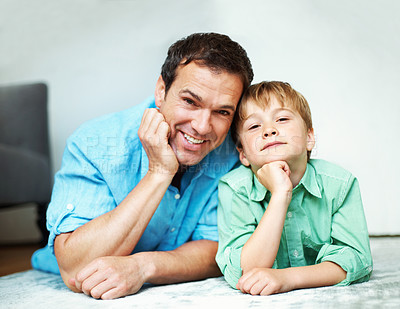 Buy stock photo Happy, portrait and dad with child, lounge and bonding with son on floor, break and family in house. Man, home and connection with kid in living room, love and single parent with smile for boy in USA