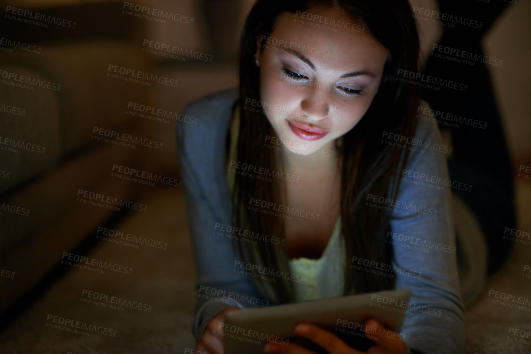 Buy stock photo Teenager, reading and tablet with girl in home at night for social media post, ebook novel and streaming. Digital library, story subscription and evening entertainment with person on floor in house