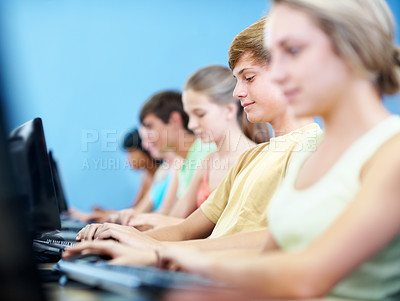 Buy stock photo Computer, learning and typing with students in classroom for education, lecture or IT lesson. Teenager, high school and technology with people for programming class, online assessment or project