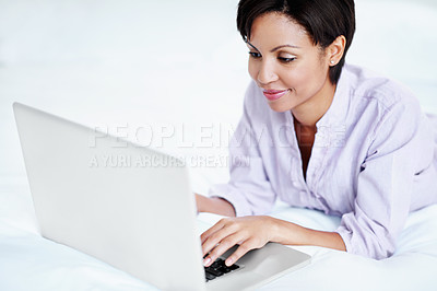 Buy stock photo Relax, woman and typing with laptop on bed for movie website, series search and weekend break. Smile, person and digital tech in home for film selection, tv show subscription or holiday entertainment