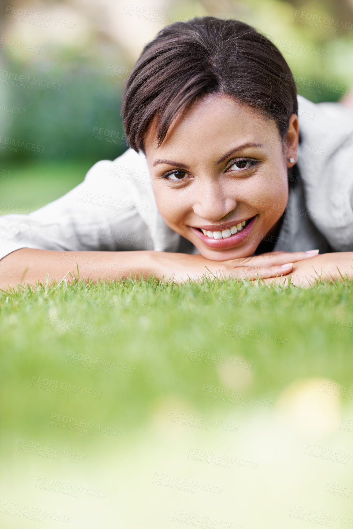 Buy stock photo Portrait, relax and woman on grass with smile, peace and comfortable for summer holiday. Happy, female person or lawn in nature with positive attitude, calm morning and unwind at vacation destination