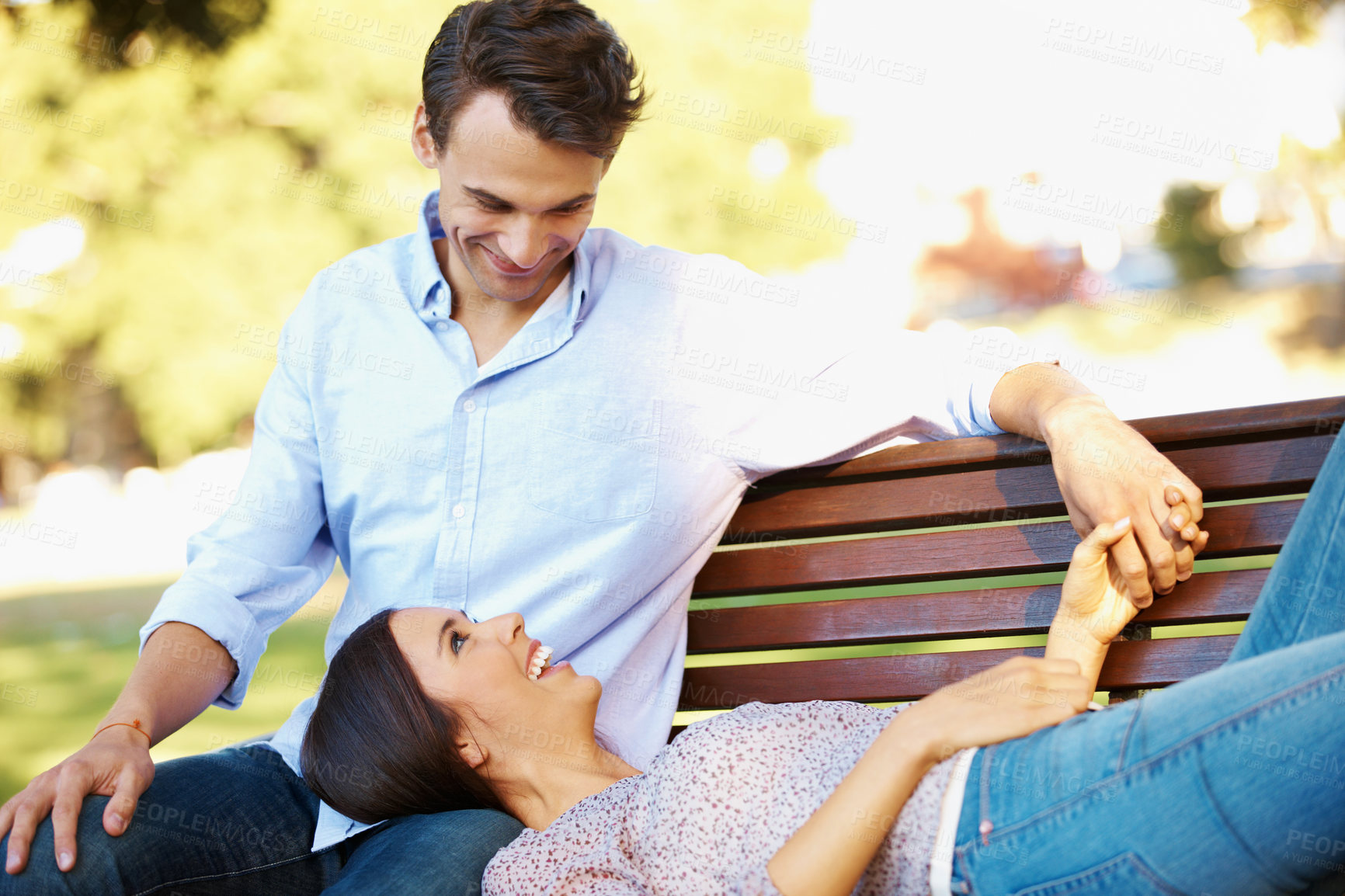 Buy stock photo Date, happy and laugh with couple on park bench for connection, honeymoon vacation and bonding. Smile, spring and joke with man and woman outdoor for commitment, romance and relationship together