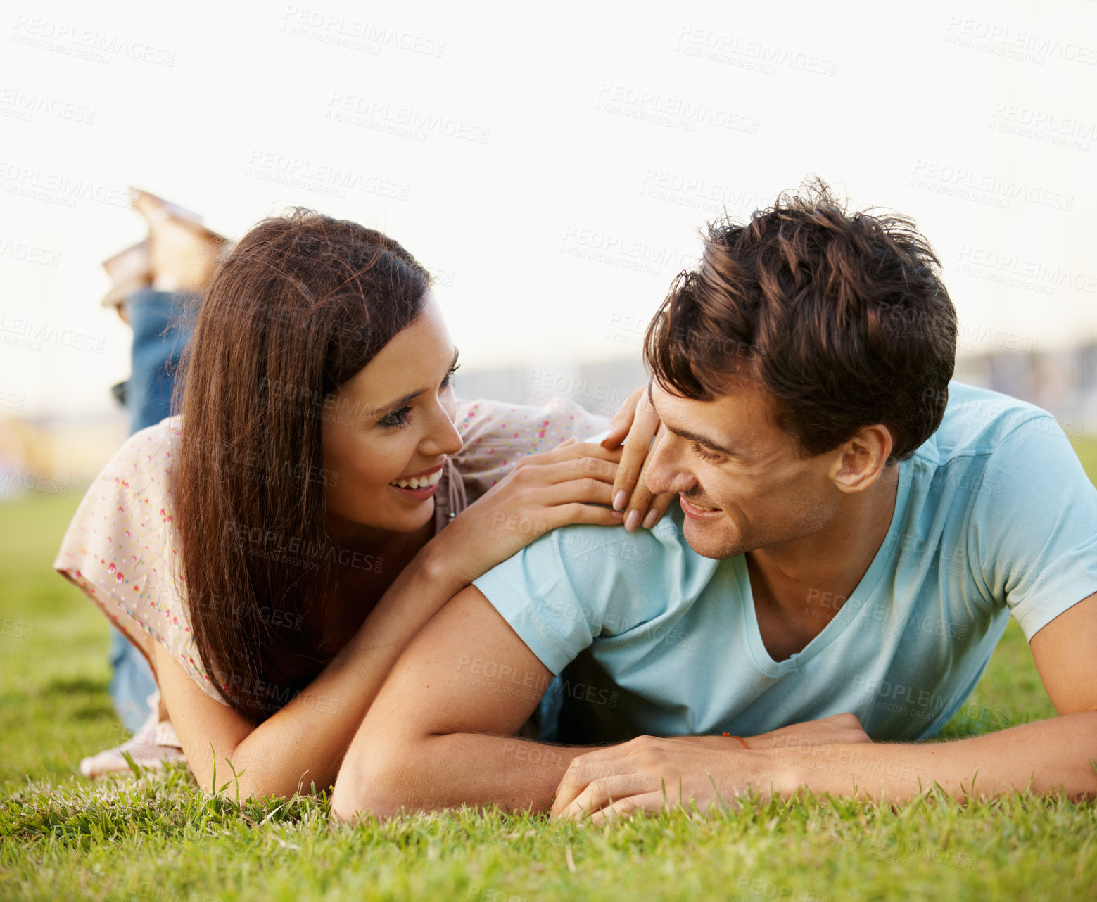 Buy stock photo Love, relax and laughing with couple in park for romance, affection and care together. Summer date, honeymoon and relationship with man and woman bonding in nature for support, joke and happiness
