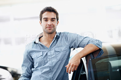 Buy stock photo Man, portrait and confident in car dealership for vehicle purchase, appointment and finance. Loan approval, showroom and person shopping for motor rental, retail and service for transport buyer