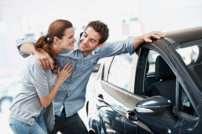 Buy stock photo Hug, happy couple and shopping at car dealership, inspection and decision for automobile with support. Showroom, man and woman check vehicle for purchase, embrace and transport with customers