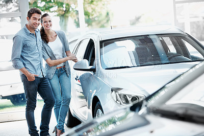 Buy stock photo Smile, couple and shopping at showroom with car, inspection and test drive for transport choice. Portrait, people and customer at dealership with vehicle, finance approval and auto purchase decision