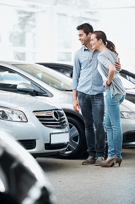 Buy stock photo Happy, couple and browsing in showroom for new car, consider sale promotion and motor insurance. Married people, smile and shopping in dealership for vehicle, investment decision and retail purchase.