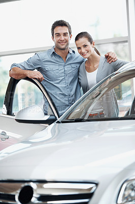 Buy stock photo Happy, couple and customer at dealership with car, inspection and transport for test drive. Portrait, people or satisfaction in showroom with vehicle, finance approval and collection of auto purchase
