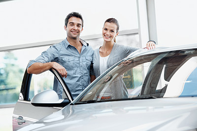 Buy stock photo Smile, couple and customer at dealership with car, inspection and transport for test drive. Portrait, people or satisfaction in showroom with vehicle, finance approval and collection of auto purchase