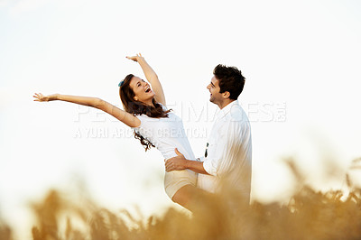 Buy stock photo Love, excited and laugh with couple in field for connection, bonding and spring date together. Support, happiness and marriage anniversary with man and woman in countryside for joke and getaway