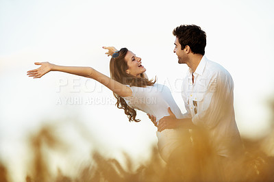 Buy stock photo Love, excited and smile with couple in field for connection, bonding and spring date together. Support, happiness and marriage anniversary with man and woman in countryside for care and getaway