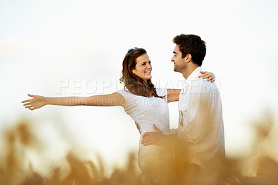 Buy stock photo Love, fun or couple in nature with hug, happy partner or bonding together on summer break. Romance, space or people in countryside with embrace, romantic connection or playful moment on outdoor date.