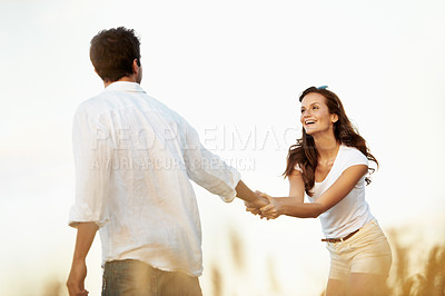 Buy stock photo Couple, smile and woman holding hands in meadow, partner and support with care in nature. Female person, happiness and man outdoor for healthy relationship, bonding and together with space in Italy