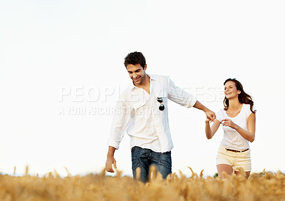 Buy stock photo Excited, couple and holding hands in wheat field for vacation, bonding or romance in countryside. Happy, man and woman in nature for weekend trip together with holiday, anniversary and playful travel