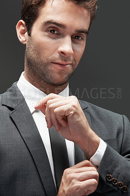 Buy stock photo Cufflink, professional and portrait of business man in studio for about us, corporate and financial advisor. Portfolio manager, broker and confidence with male employee on gray background for pride