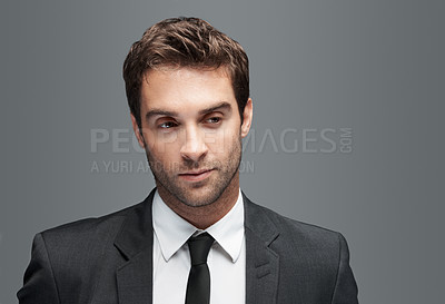 Buy stock photo Serious, professional and thinking with business man in studio for vision, corporate and financial advisor. Portfolio manager, broker and reflection with male employee on gray background for pride