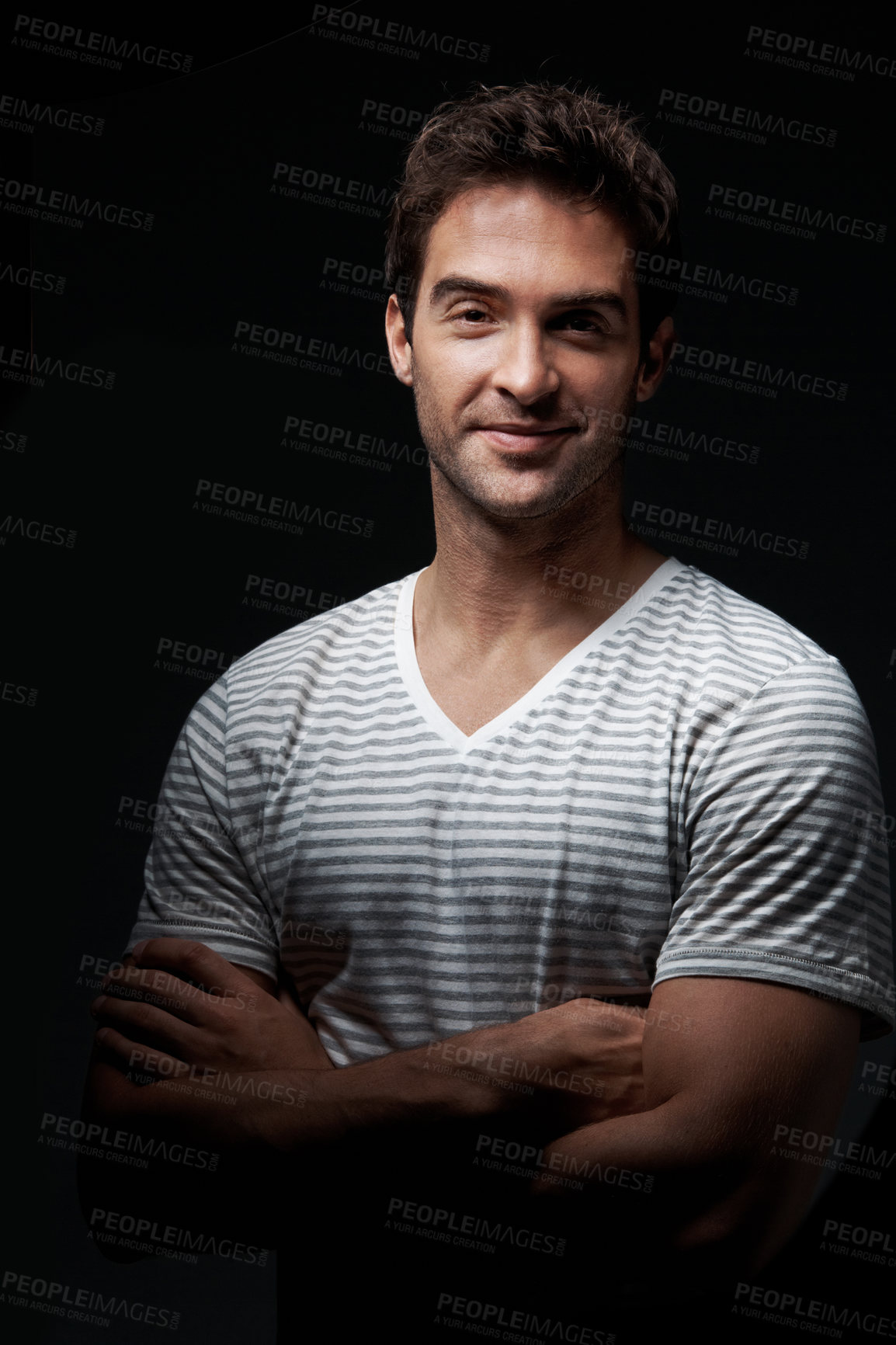 Buy stock photo Studio, portrait or happy man with confidence for fashion, style or mysterious behaviour on a dark background. Smile, male person or clothing with arms crossed or shadow for hidden or secret identity