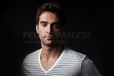 Buy stock photo Serious, man and designer in studio with portrait, career pride and about us for clothes launch. Creative, male person and entrepreneur with ambition, attitude and apparel tailor on dark background