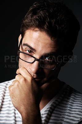 Buy stock photo Glasses, nerd and portrait of man in studio for vision, eyewear style and aesthetic for fashion. Hipster, smart and person with trendy frames, prescription lens and spectacles on dark background