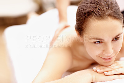 Buy stock photo Cute young woman lying on a spa bed and smiling while waiting for a massage