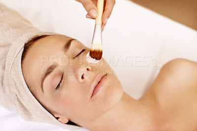 Buy stock photo Young woman receiving a face mask treatment at a spa
