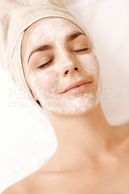 Buy stock photo Young woman enjoying a face mask treatment at a spa