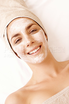 Buy stock photo Happy young woman enjoying a face mask treatment at a spa