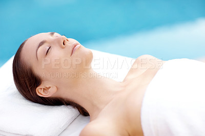 Buy stock photo Pretty young woman lying serenely while waiting for a spa treatment to begin