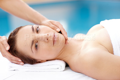 Buy stock photo Portrait of a beautiful woman receiving a massaging spa treatment from a therapist 
