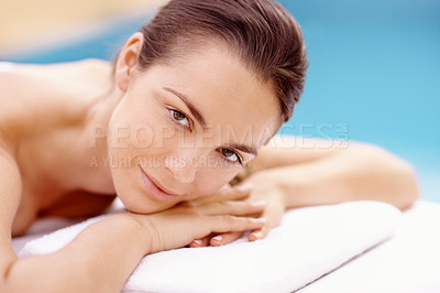 Buy stock photo Beautiful young woman lying on a spa bed and waiting for her treatment to begin - portrait 