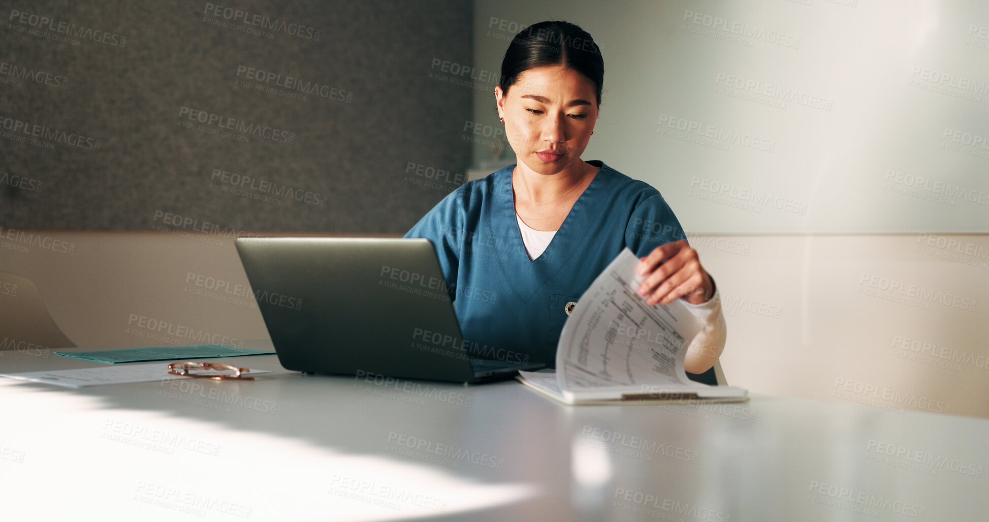Buy stock photo Nurse, paperwork and woman with laptop in clinic, administration or reading medical records on web. Healthcare, information and asian person with tech for test results, documents or hospital research