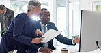 Computer, research and discussion with mentor in office, teamwork and risk management with paperwork. Corporate, business meeting and people with tech, credit underwriter and advice for assignment