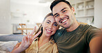 Peace sign, selfie and smile with couple on sofa in home for connection, photography and support. Commitment, online post and relax with man and woman in living room in apartment for picture pov