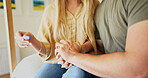 Couple, support and holding hands in house with pregnancy test, bonding together and wait for results. Married people, check fertility and comfort with love, hope and expectation for pregnant wife.