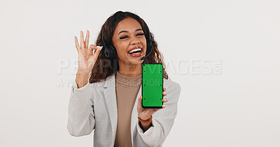Buy stock photo Okay sign, phone and woman with green screen for call center, contact us and space for news. Mockup, happy and person with headset, cellphone or approve emoji for customer service on white background