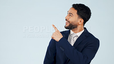 Buy stock photo Pointing, space and smile with business man in studio for real estate offer, presenter and about us. Property showcase, mockup and opportunity with employee on white background for promotion