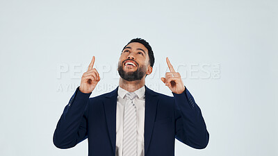 Buy stock photo Pointing, space and happy with business man in studio for real estate offer, presenter and about us. Property showcase, mockup and opportunity with employee on white background for promotion