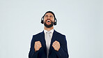 Excited, man and fist pump in studio with headset, customer praise and success for sales kpi. Smile, mockup space and agent cheering for good news, technical support and help desk on white background