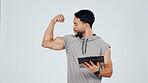 Man, clipboard and flexing bicep for fitness, gym membership document or muscle in studio. Personal trainer, sign in paperwork or exercise club for bodybuilding, strong or power on background space