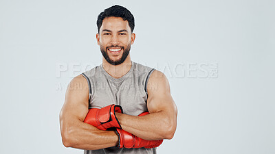 Buy stock photo Portrait, boxer and arms crossed in studio for fitness, pride and muscle with athlete about us by space. Male fighter, martial arts and strong with confidence, mockup and sports smile on background