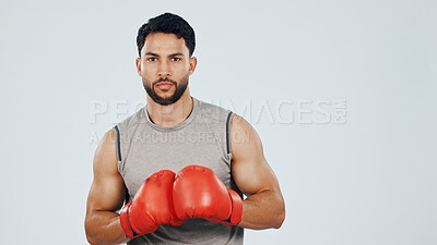 Buy stock photo Portrait, boxer and serious in studio for fitness, pride and muscle with athlete about us by space. Male fighter, martial arts and strong with confidence, mockup and sports gloves on background