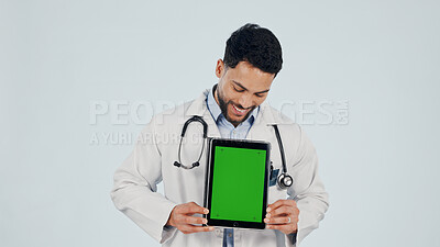 Buy stock photo Green screen, man and doctor with tablet in studio for clinic sign up, FAQ and telehealth. Technology, mockup space and  male healthcare worker on app for medical information by white background.
