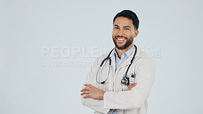 Buy stock photo Pride, portrait and doctor with arms crossed, ambition or about us in medical industry. Healthcare, mockup space or man with confidence, career growth or wellness practitioner on studio background.