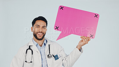 Buy stock photo Happy, portrait and doctor in studio with speech bubble, announcement or healthcare advice. Space, social media and man with sign for medical news, information or tips for mockup on white background