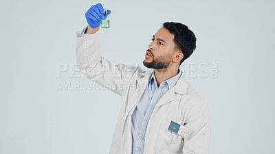 Buy stock photo Scientist, man and chemical beaker in studio for inspection, pharma development and space. Science, chemistry and person with liquid for drug experiment, medical research or study on white background