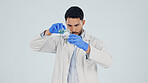 Scientist, man and pour chemical in beaker at studio for experiment, pharma development and space. Science, chemistry innovation and person with liquid, medical research or study on white background